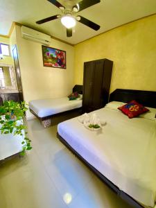 Postel nebo postele na pokoji v ubytování Hotel Melina