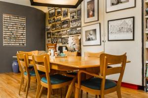 a dining room with a wooden table and chairs at Ray's Bucktown Bed and Breakfast in Chicago