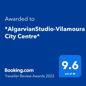 a blue sign with the text awarded to albuquerquebuquerque city centre at *AlgarvianStudio-Vilamoura City Centre* in Vilamoura