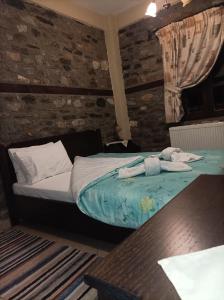 Cama o camas de una habitación en Guesthouse Naouma