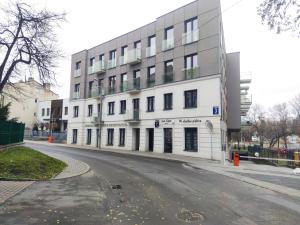 a large white building on a city street at Apartament Czechowska Luxury in Lublin