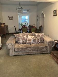 a living room with a couch and a table at Ringfort Manor in Rathfriland