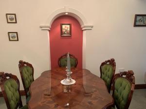 a dining room with a table and chairs at Ringfort Manor in Rathfriland