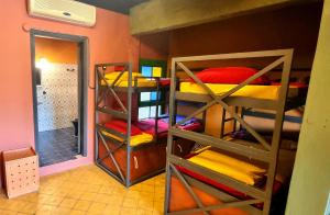 a room with several bunk beds in a room at Circo Hostel in Asuncion