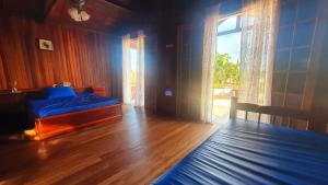 Ένα ή περισσότερα κρεβάτια σε δωμάτιο στο Muito espaço, Piscina, Churrasqueira, Wi-Fi, SmartTV