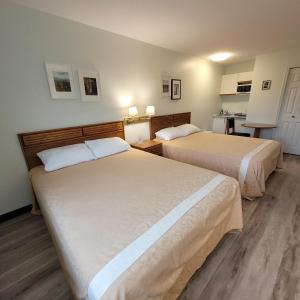 מיטה או מיטות בחדר ב-Ridgeview Motor Inn