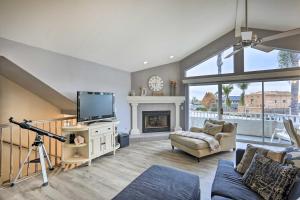 a living room with a tv and a fireplace at Ideally Located Ocean Escape Near Beach and Wineries in Grover Beach