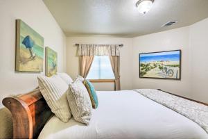 a bedroom with a white bed and a window at Ideally Located Ocean Escape Near Beach and Wineries in Grover Beach