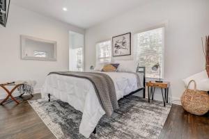 a white bedroom with a bed and a window at StayATL - Studio9Forty in Midtown, Atlanta #120 in Atlanta
