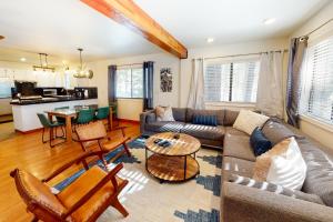 a living room with a couch and a table at Pine Perch in Truckee