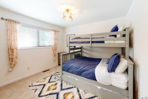 a bedroom with two bunk beds and a rug at Pine Perch in Truckee