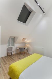 Katil atau katil-katil dalam bilik di Suite Appart Place Versepuy