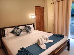 Postel nebo postele na pokoji v ubytování Lalisa Hotel Aonang