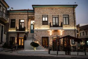 a brick building with a staircase in front of it at Battaglia di Lepanto in Nafpaktos