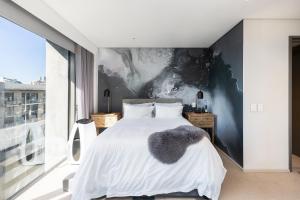 Katil atau katil-katil dalam bilik di Always-Power Trendy De Waterkant Loft