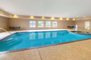 a large swimming pool in a hotel room at La Quinta by Wyndham Longview North in Longview