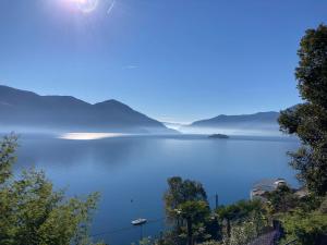 a view of a lake with boats in the water at BnB122 bed&breakfast in Ascona