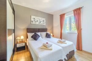 Posteľ alebo postele v izbe v ubytovaní Villa Ankora