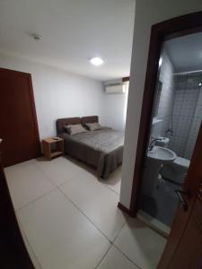 a bedroom with a bed and a sink at Yeşilyurt otel in Antalya