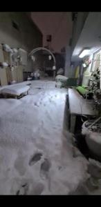 a room with snow on the floor of a room at The family apartment - דירת המשפחה in Majdal Shams