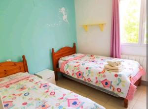 Postel nebo postele na pokoji v ubytování Villa Elisa