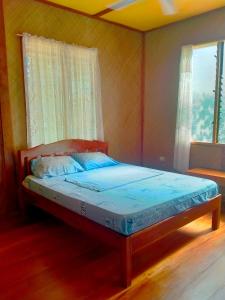Postel nebo postele na pokoji v ubytování JJS BACKPACKERS VILLAGE