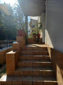 a set of stairs leading up to a building at Hotel Korydallos in Piraeus