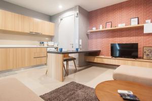 a small living room with a table and a tv at iCity 1Bedroom Apt Near Mall & ThemePark RM59 in Shah Alam