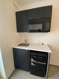 Kuchyň nebo kuchyňský kout v ubytování Hotel Nest