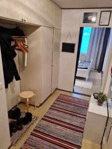 a small room with a closet and a stairway at Syväraumankatu 32 as 3 in Rauma