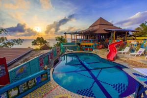 a pool at a resort with a water park at Varinda Resort in Lamai