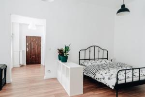 Łóżko lub łóżka w pokoju w obiekcie Podzamcze 24 Apartments