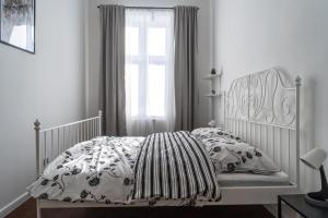 Łóżko lub łóżka w pokoju w obiekcie Podzamcze 24 Apartments