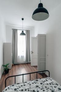 Łóżko lub łóżka w pokoju w obiekcie Podzamcze 24 Apartments