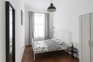 Łóżko lub łóżka w pokoju w obiekcie Podzamcze 24 Apartments