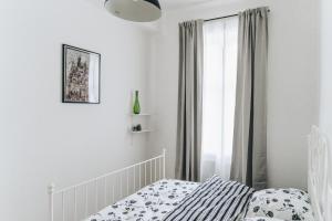 Łóżko lub łóżka w pokoju w obiekcie Podzamcze 24 Apartments
