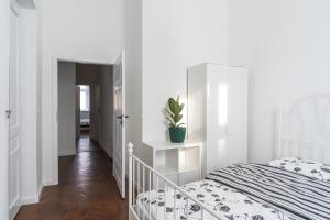 Łóżko lub łóżka w pokoju w obiekcie Podzamcze 24 Apartments