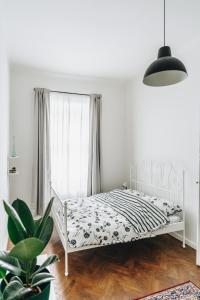 Łóżko lub łóżka w pokoju w obiekcie Podzamcze 24 Apartments
