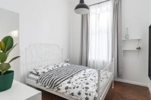 Łóżko lub łóżka w pokoju w obiekcie Podzamcze 24 Apartments