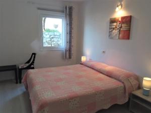 A bed or beds in a room at Garden Belvedere B&B