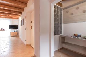 TV a/nebo společenská místnost v ubytování Casa del Borgo "Aria & Acqua" sul Lago Maggiore