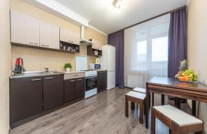 a kitchen with a table and a dining room at Apartment with View on 24 floor in Kyiv