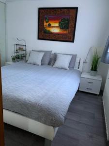 Säng eller sängar i ett rum på Privé chalet op vakantiepark Marina Beach