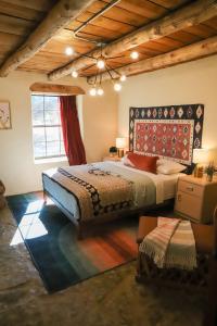 a bedroom with a large bed in a room at CASITA MISTICA Farm House at El Mistico in Nogal