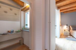Postel nebo postele na pokoji v ubytování Casa del Borgo "Aria & Acqua" sul Lago Maggiore