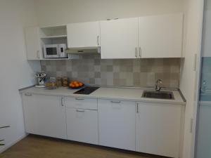 Kuchyň nebo kuchyňský kout v ubytování Residenza Capitello 48