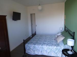 Postel nebo postele na pokoji v ubytování Residenza Capitello 48