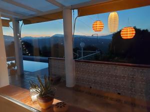 a balcony with a view of the mountains at B&B Buena Vista in Alhaurín el Grande