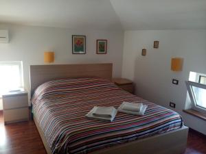 Una cama o camas en una habitación de B&B Q3 Home