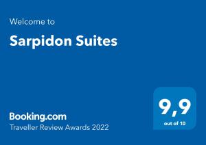 a blue sign with the words sappron suites at Sarpidon Suites in Agia Marina Nea Kydonias